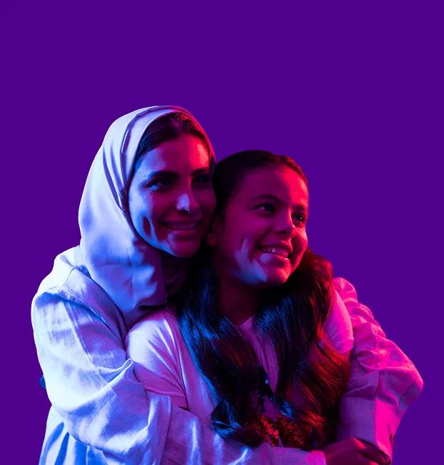 stc Bahrain's values and commitment, starts with family. A mom and a child hugging and seen happy together