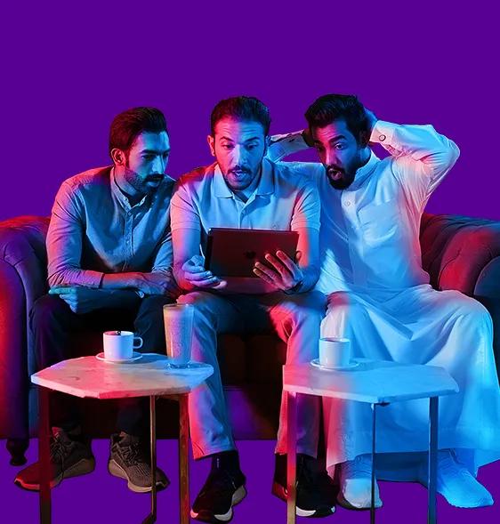 image of 3 guys holding tablet