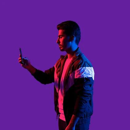 Image of a guy holding phone