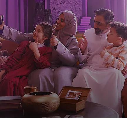 family taking a photo together at home