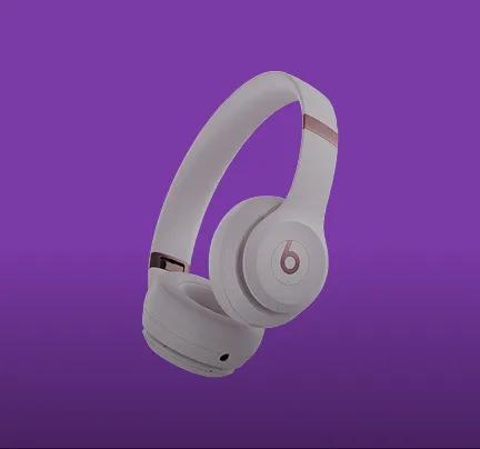 wireless over-ear headphones on purple background
