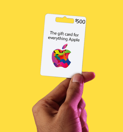 Hand holding digital gift card for Apple iTunes available at stc Bahrain