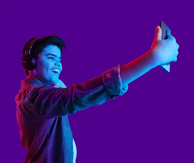 Essential gear to help you get started - millennial teenager doing a selfie with his headphones on