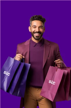 A guy carrying bags and smiling